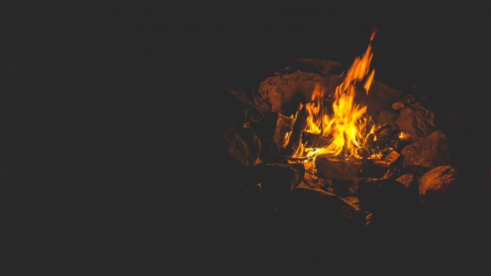 Free Image of Campfire glowing in the dark night 