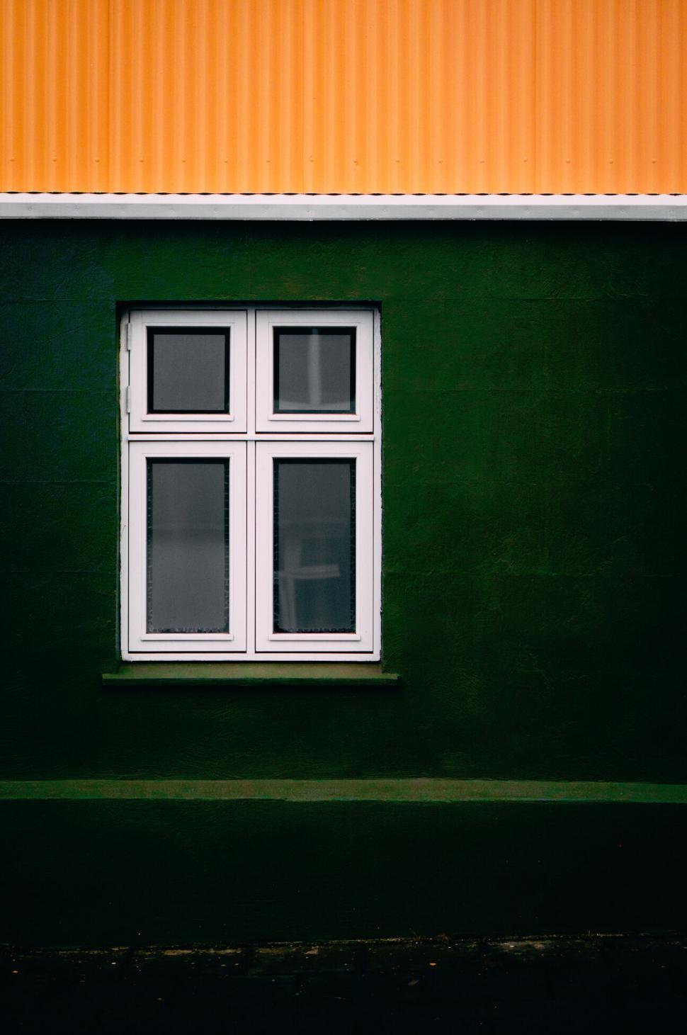 Free Image of Abstract contrast of window on a dark wall 