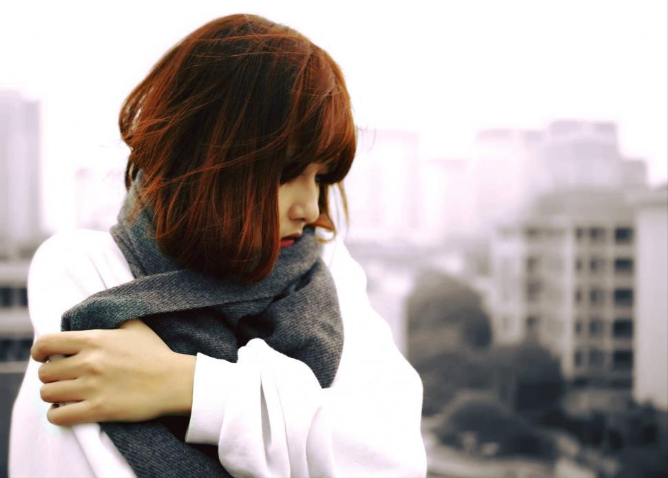 Free Image of Woman embracing herself on a cold day 