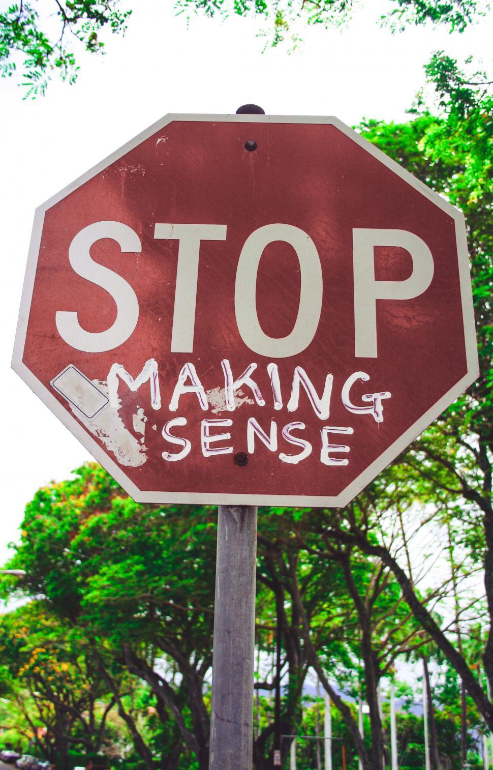 Free Image of Altered stop sign with quirky message 