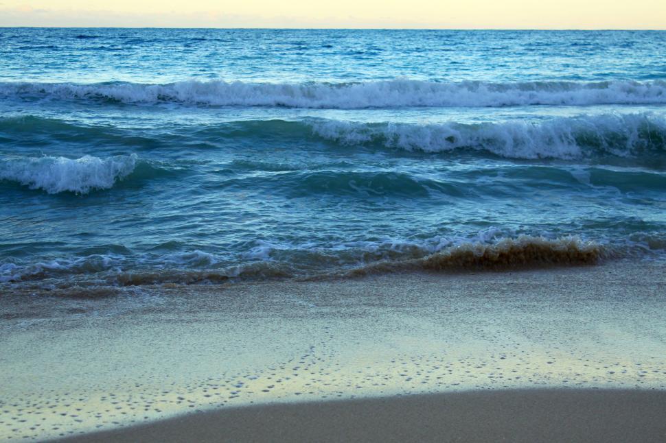 Free Image of Calming seascape with waves washing ashore 