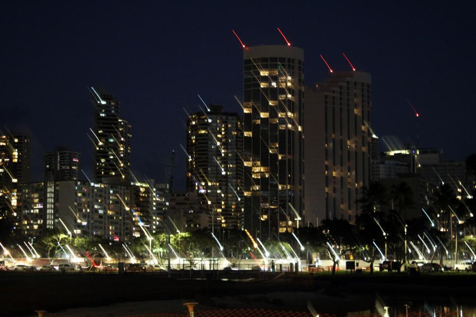 Free Image of City skyline with light streaks at night 
