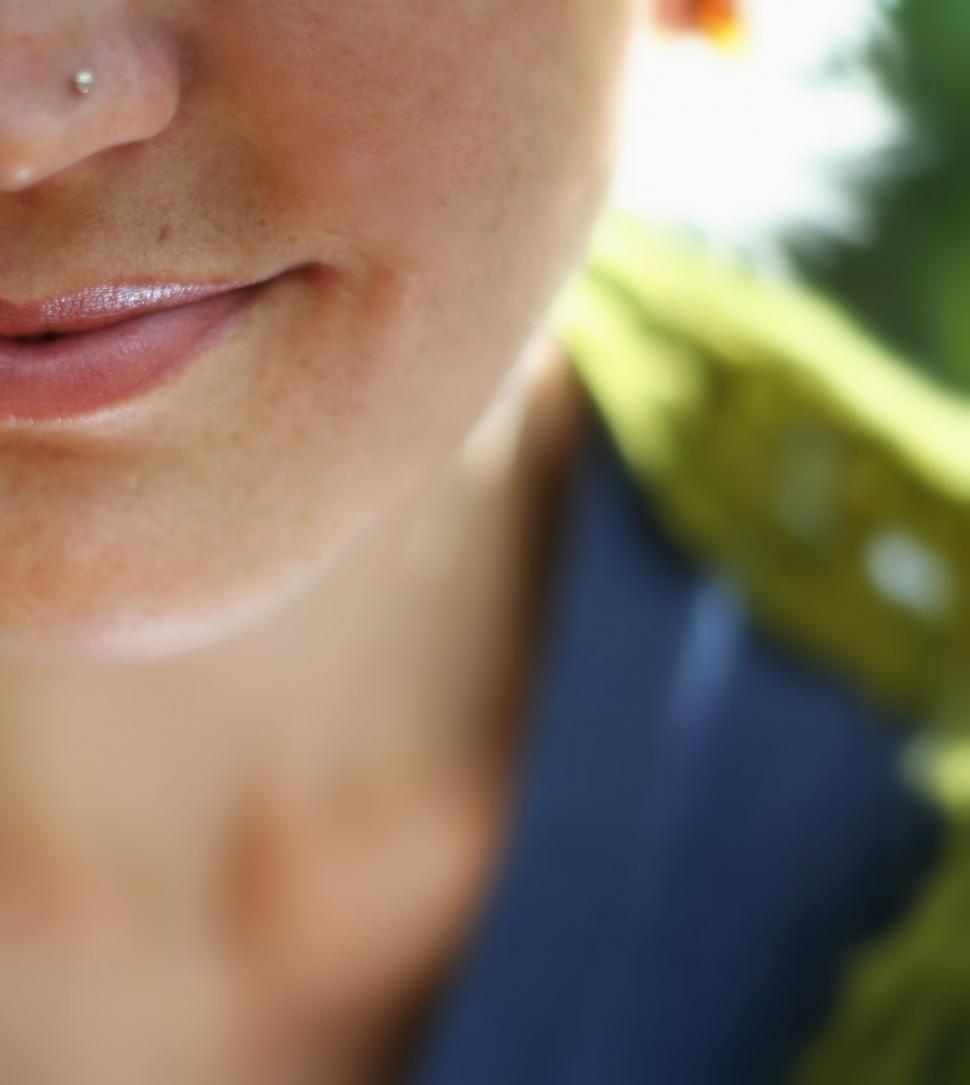 Free Image of Close-up of a woman’s smile with natural lighting 