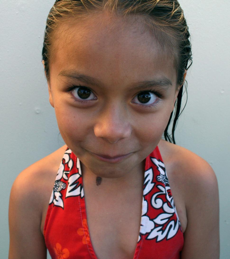 Free Image of Young girl looking at camera with wet hair 
