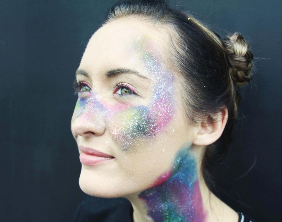 Free Image of Cosmic-themed face paint on woman 