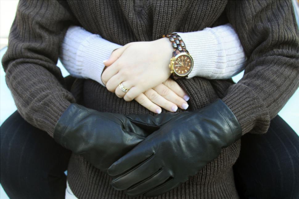 Free Image of Close-up of hands with watch and gloves 