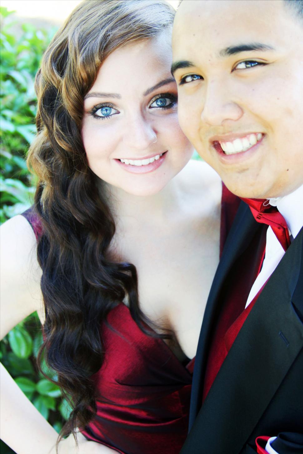 Free Image of Young couple in formal wear smiling 