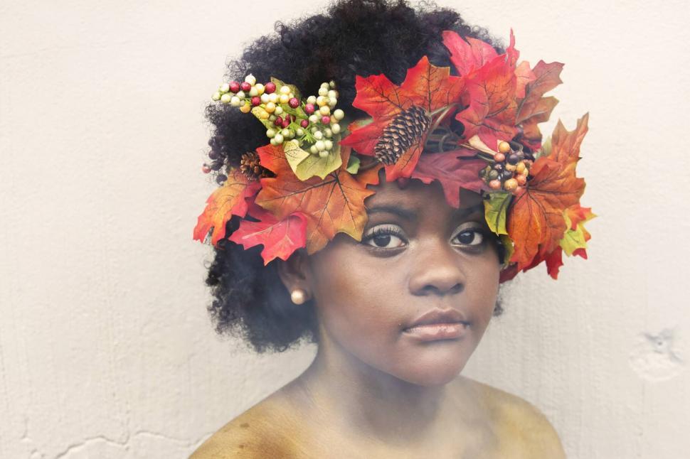 Free Image of Portrait of a woman with autumn leaves headpiece 