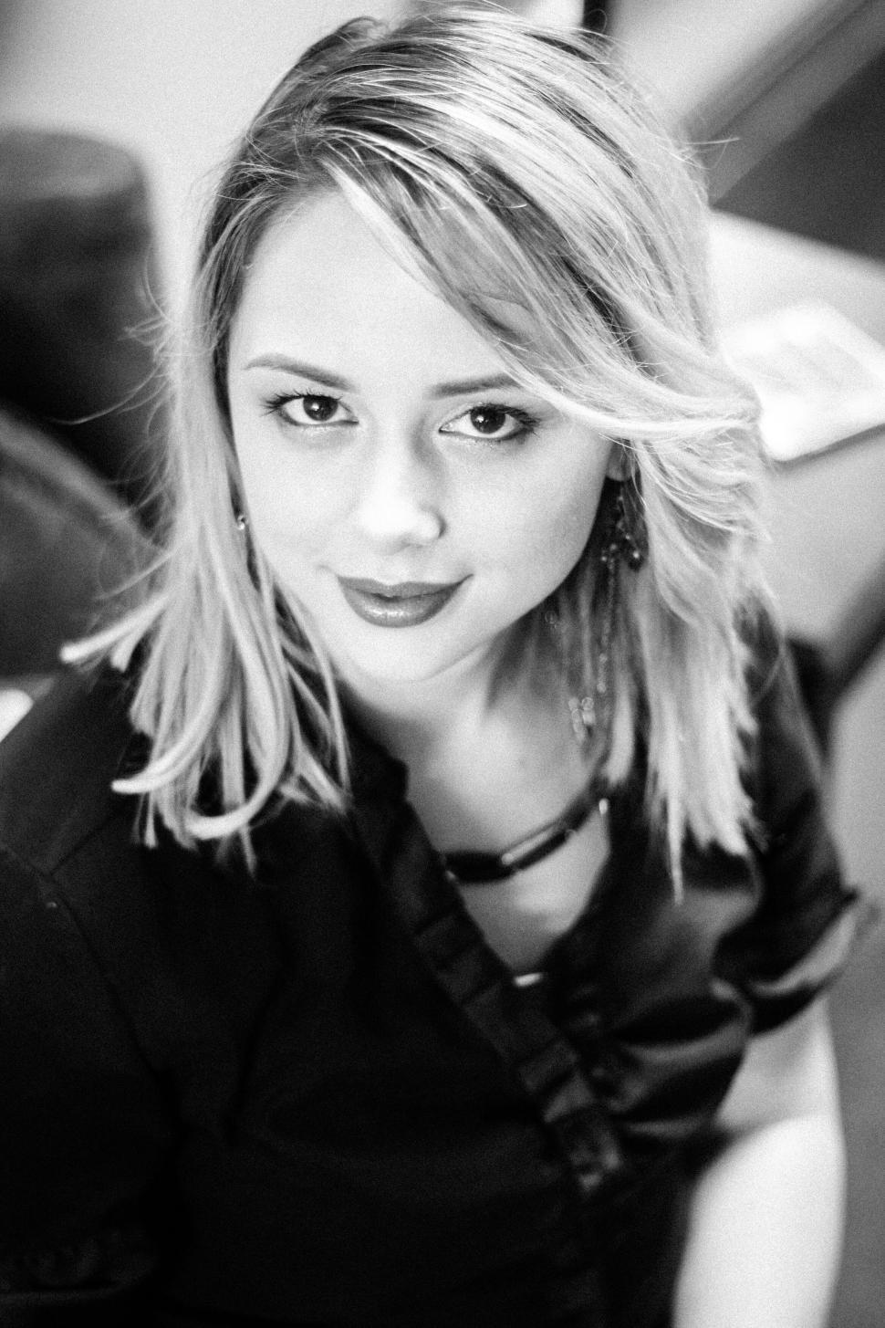 Free Image of Portrait of a young woman in black and white 