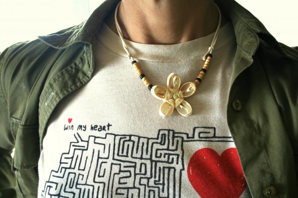 Free Image of Casual style with a unique necklace and tee 