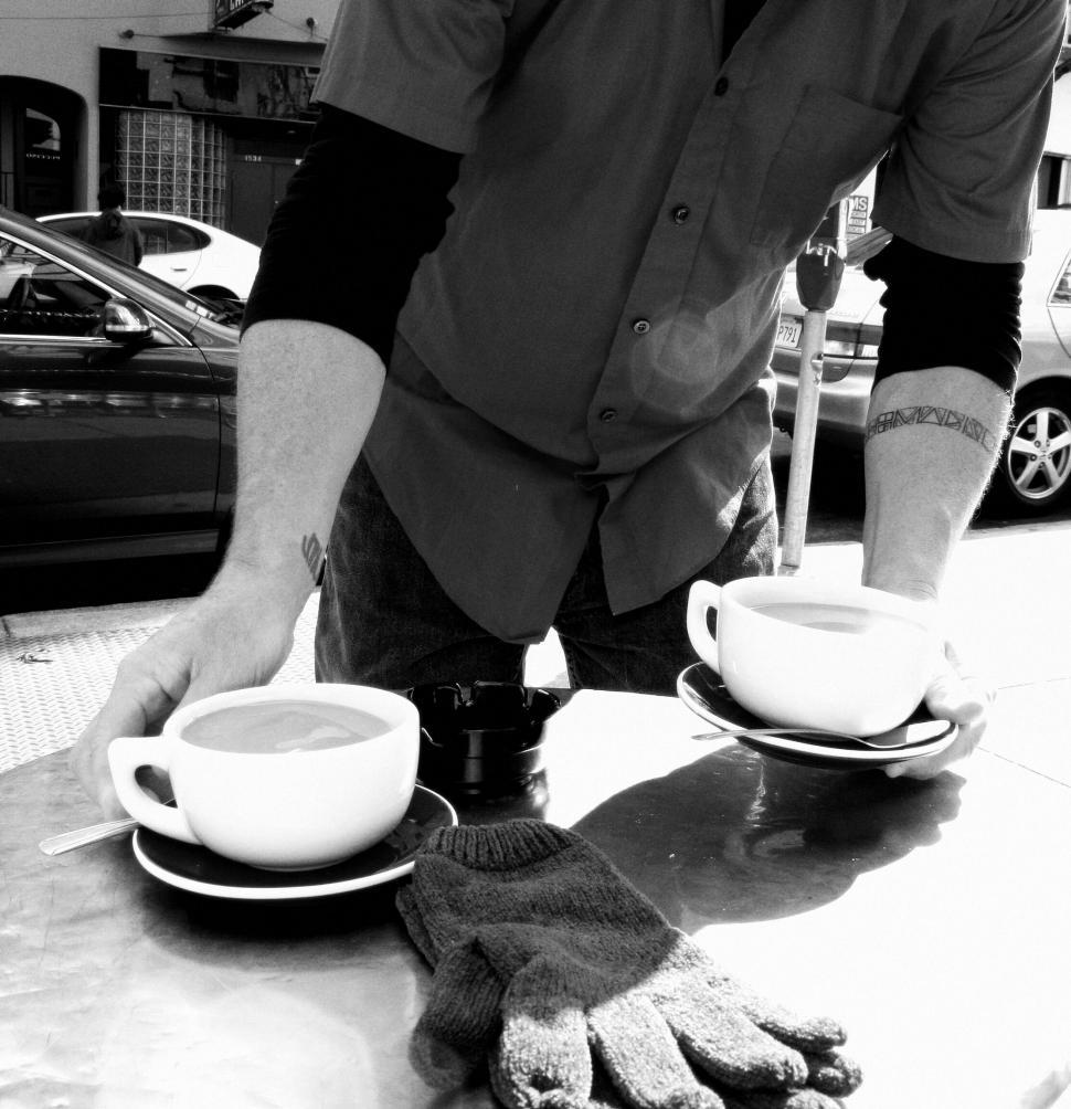 Free Image of Waiter serving two cups of coffee 