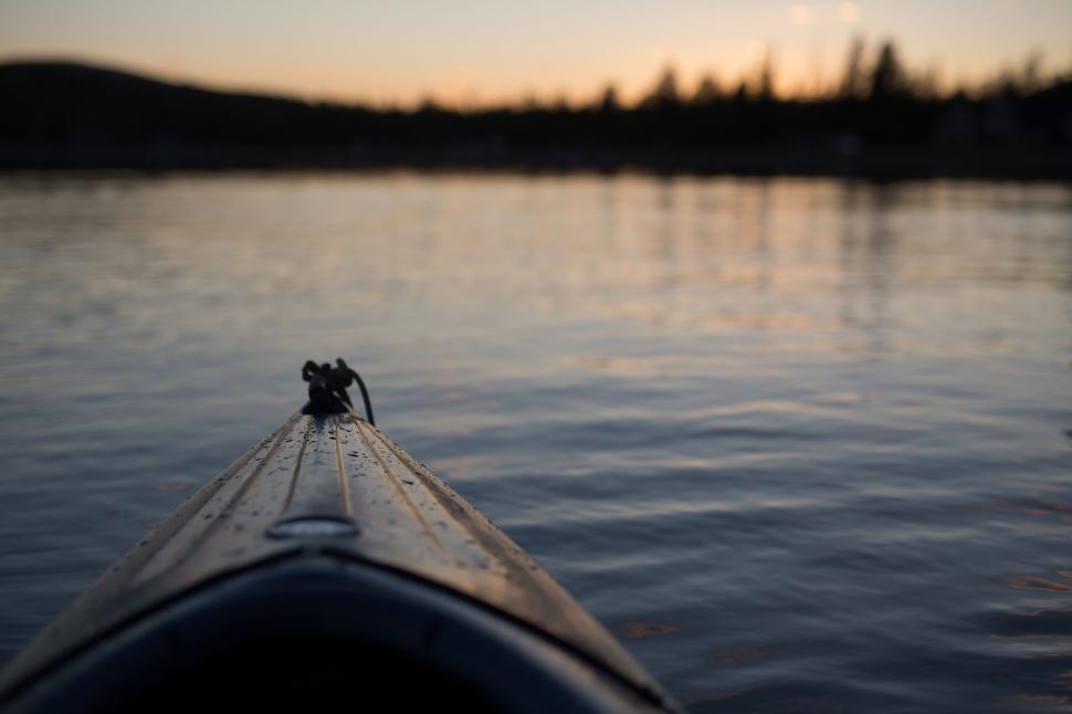 Free Image of Kayak bow overlooking a serene lake 