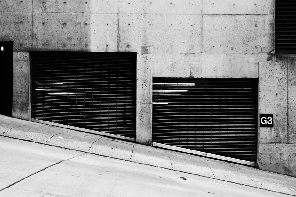 Free Image of Monochrome image of garage shutters in city 