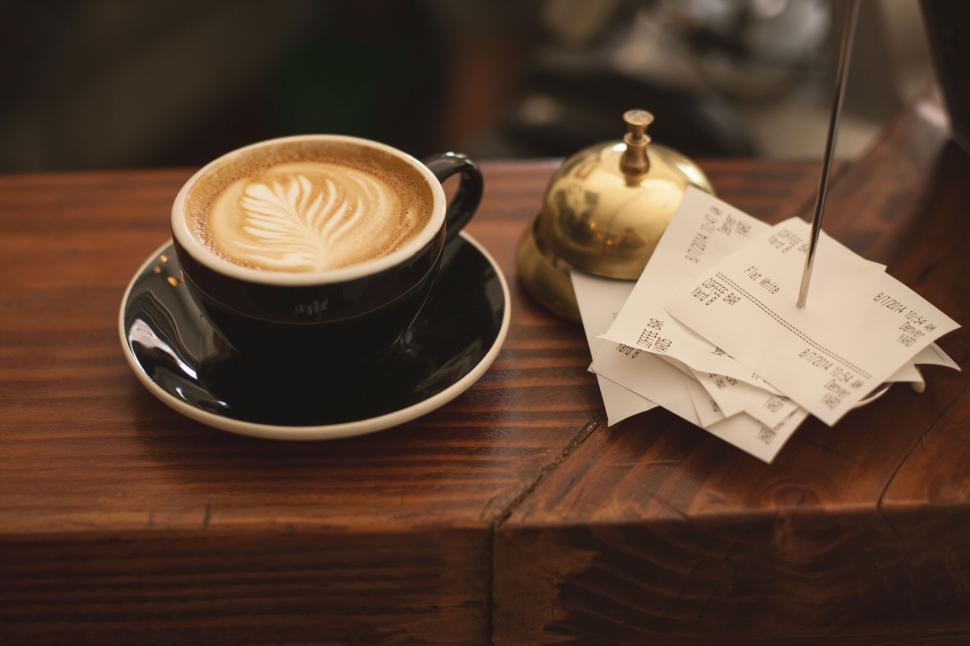 Free Image of Artistic latte on a wooden counter 