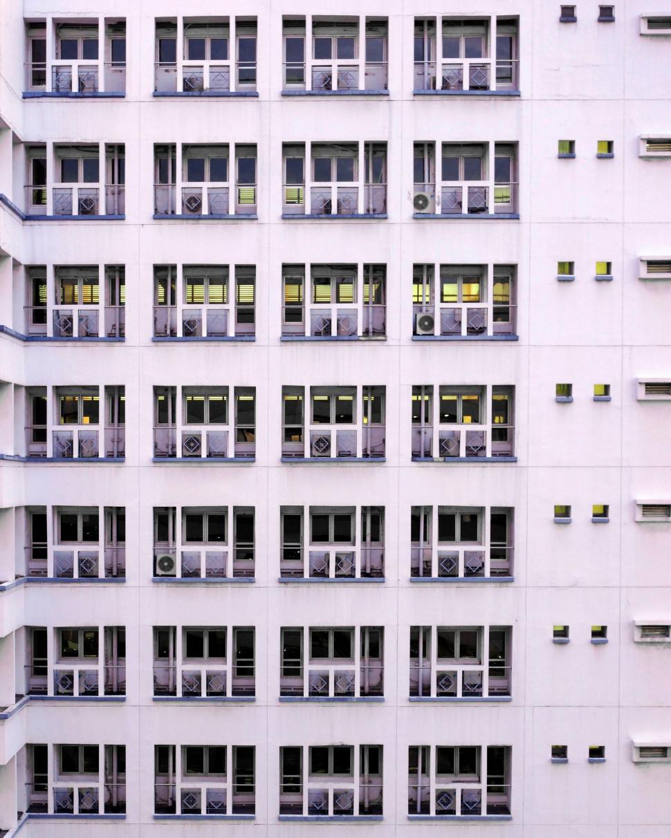 Free Image of Facade of an apartment building with AC units 