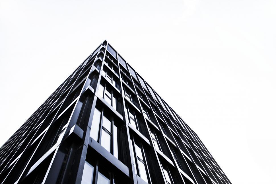 Free Image of Upward view of a modern skyscraper s facade 