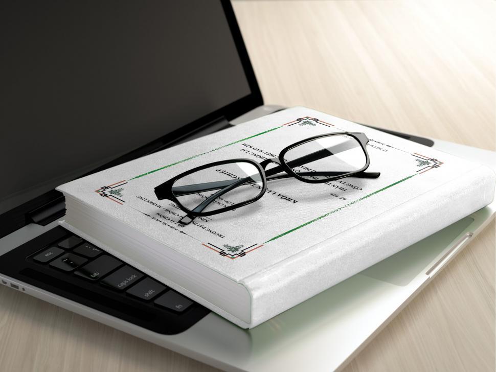 Free Image of Glasses on Open Book with Laptop Background 