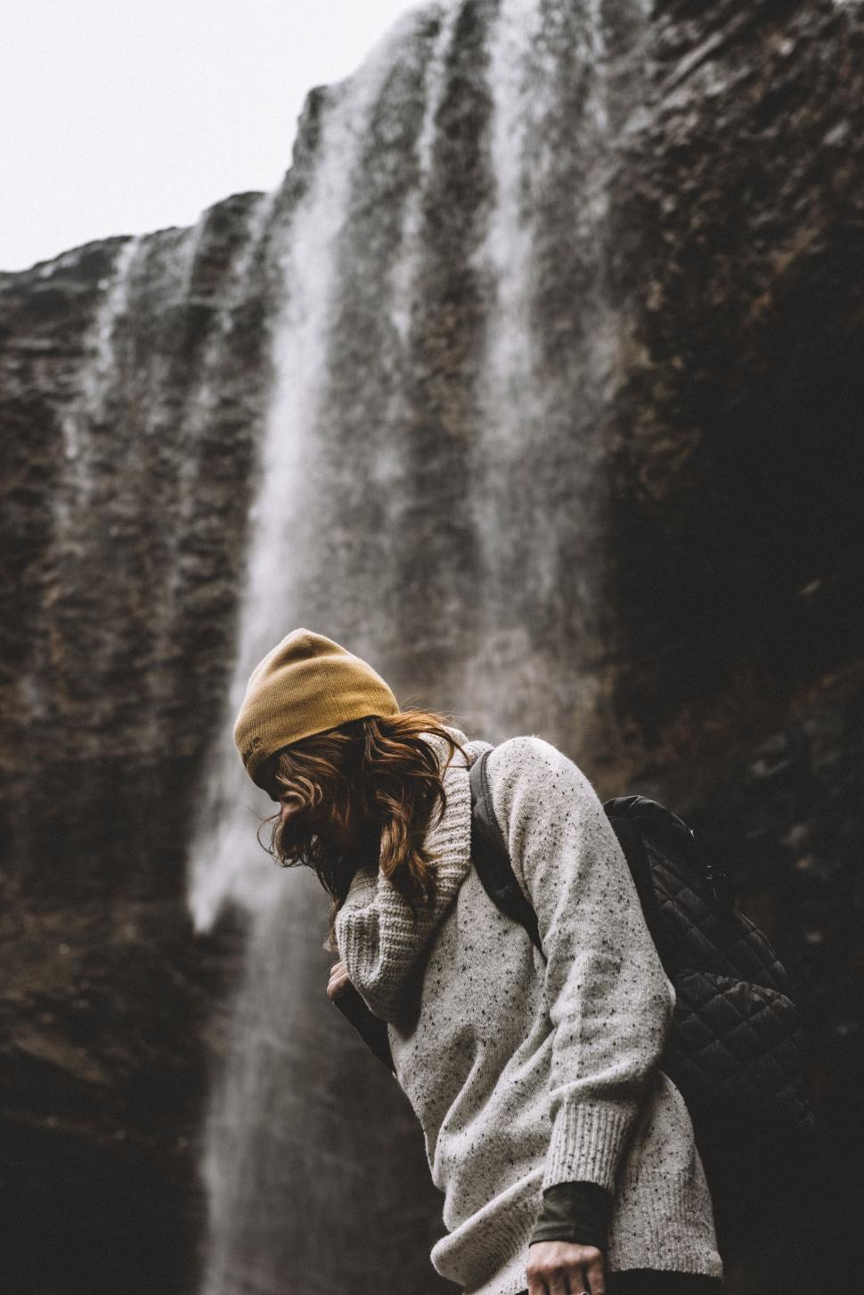 Free Image of Woman in front of waterfall in nature 