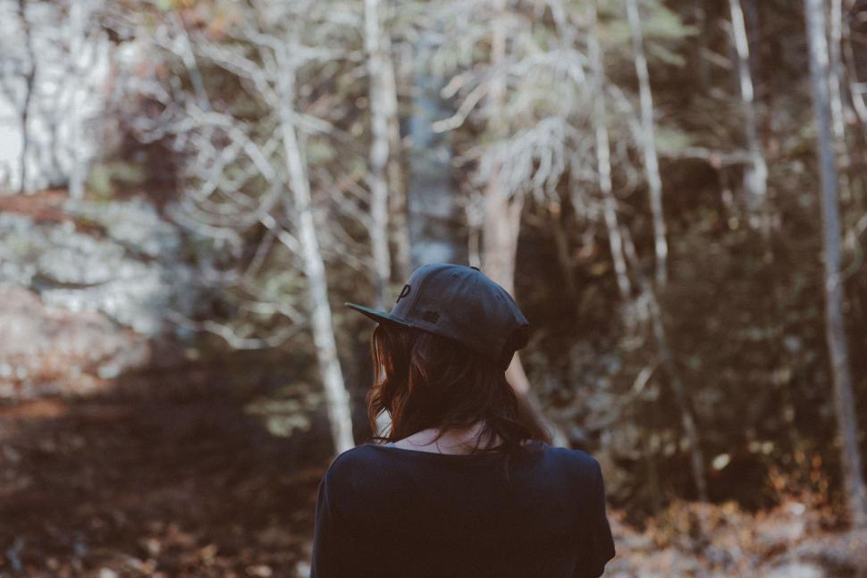Free Image of Woman in forest with focus on fall mood 