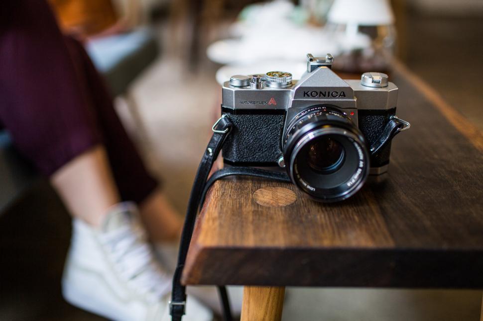 Free Image of Vintage Konica camera on a wooden table 