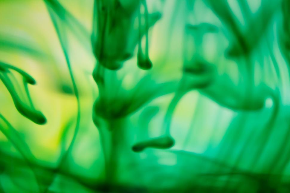 Free Image of Green ink patterns in water macro shot 
