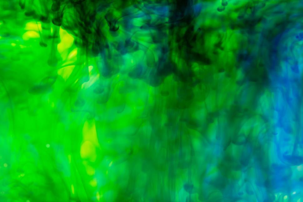 Free Image of Translucent Green Ink Diffusing into Water 