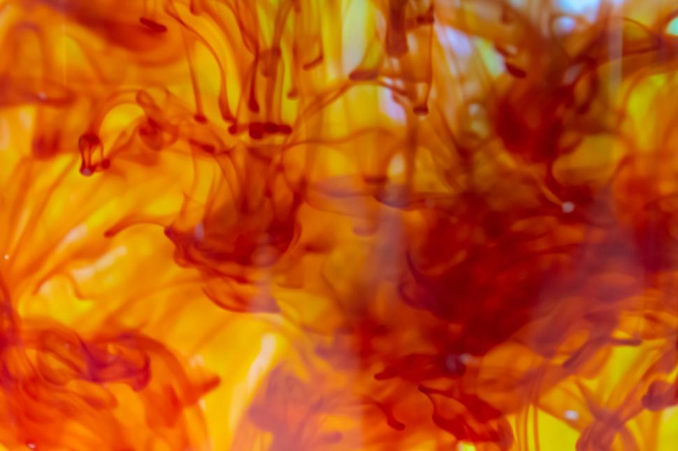 Free Image of Abstract orange and yellow ink in water 