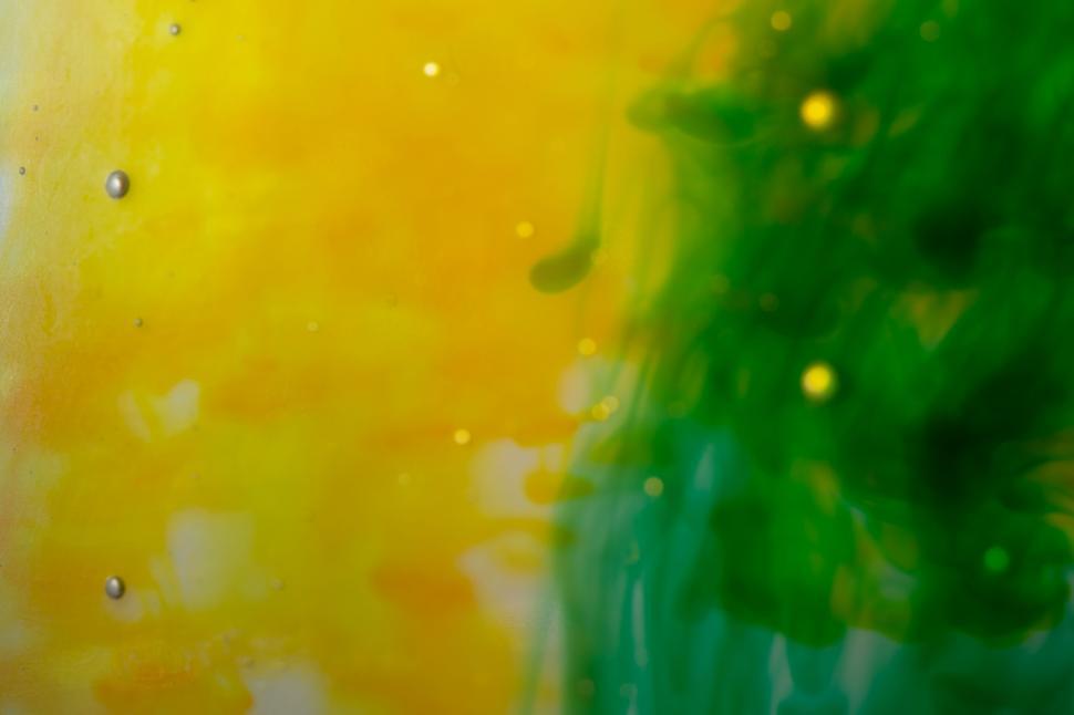 Free Image of Abstract yellow and green ink in water 