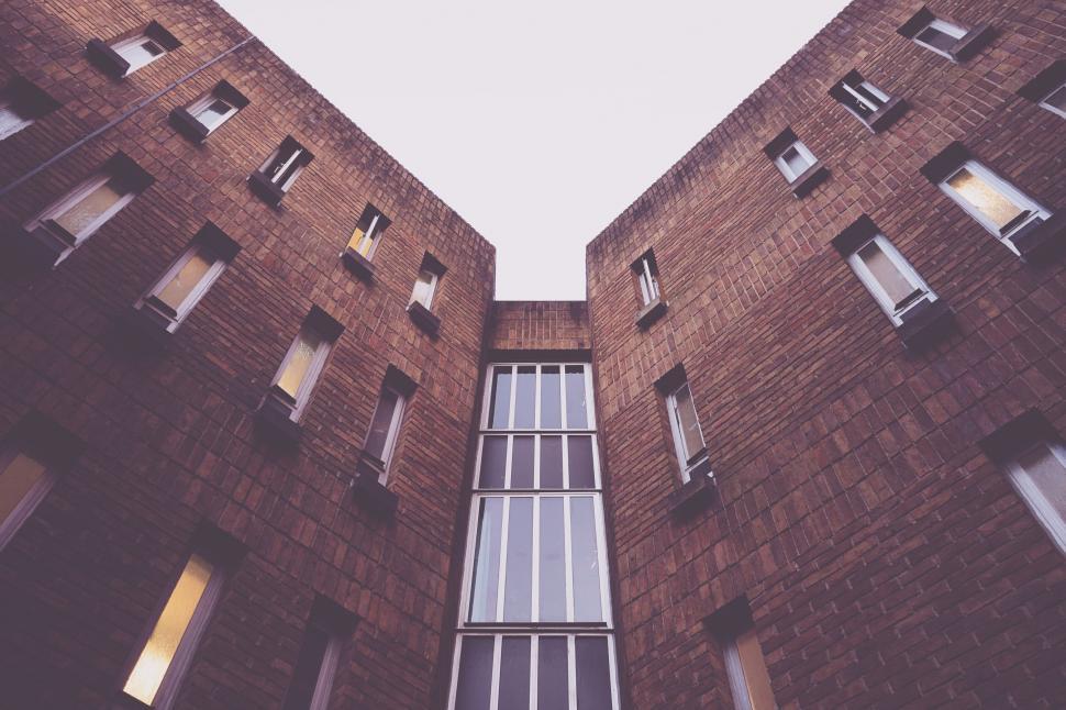 Free Image of Brick building facade with symmetrical design 