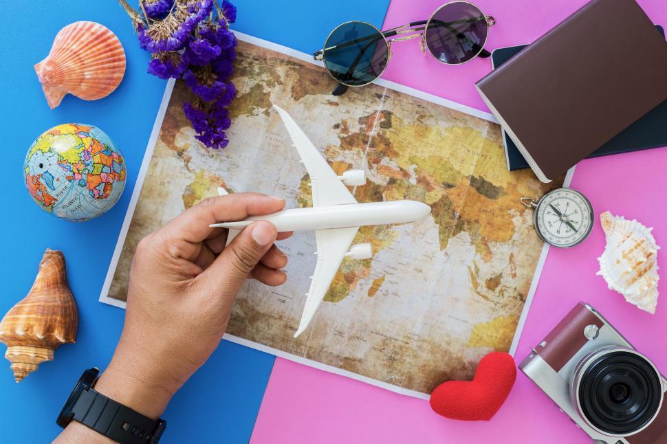 Free Image of Travel essentials flat lay on colorful background 