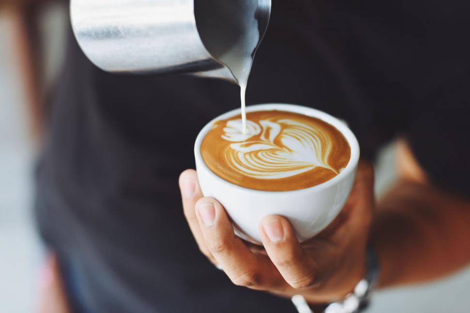 Free Image of Artistic coffee pouring in white cup 