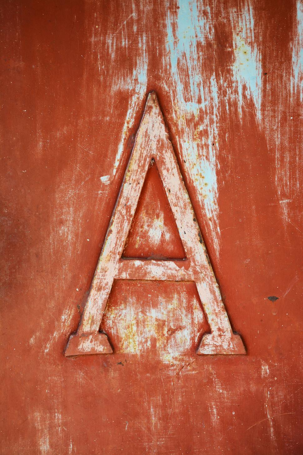 Free Image of Weathered red  A  letter on a peeled wall 