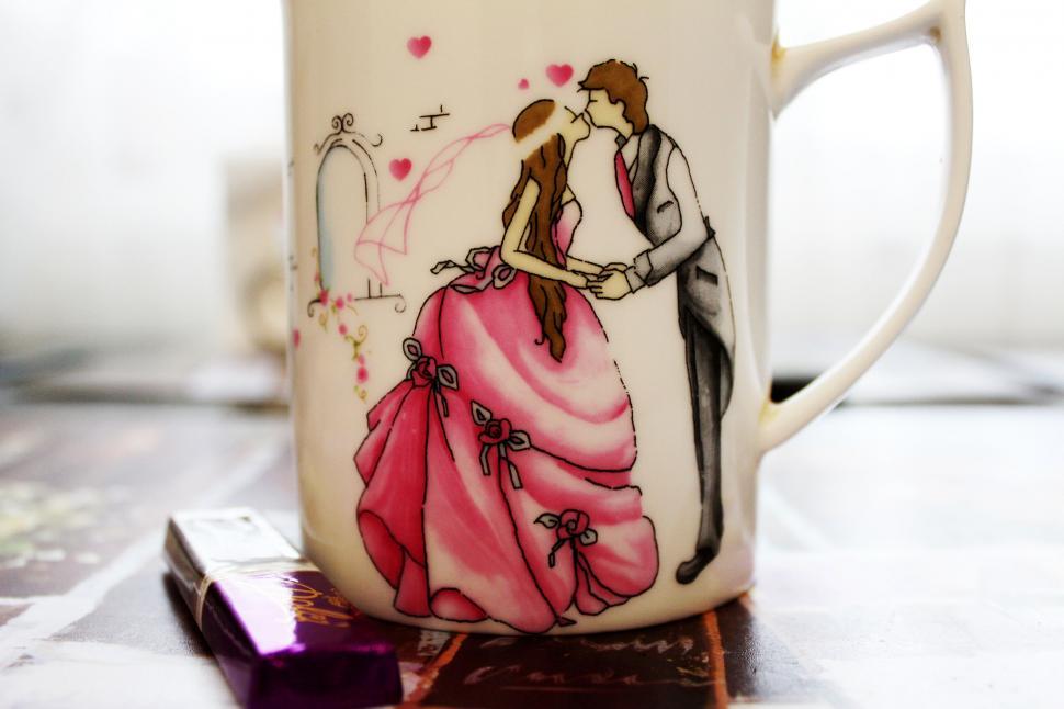 Free Image of Romantic illustration on a coffee mug 