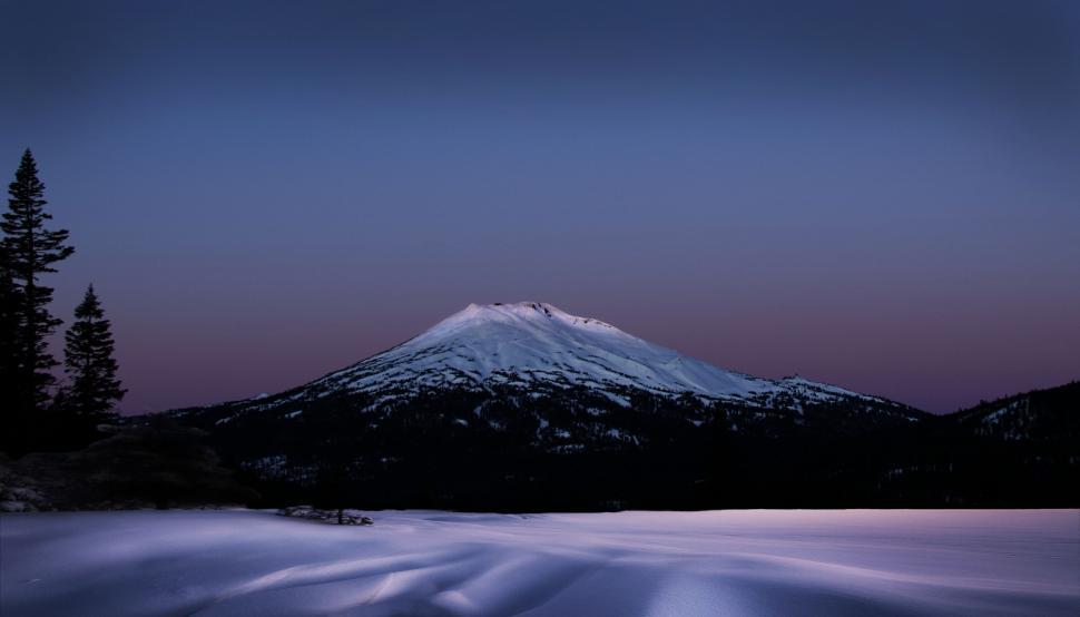 Free Image of Snow-covered mountain peak at twilight 