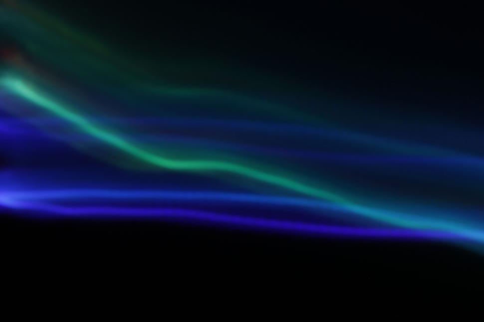 Free Image of Abstract blue light waves on black background 