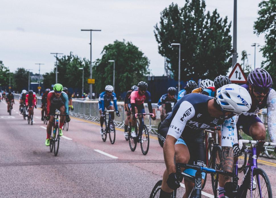 Free Image of Group of cyclists racing on street 
