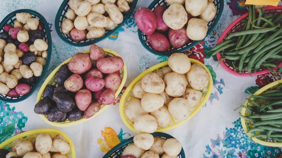 Free Image of Assortment of potatoes in colorful baskets 