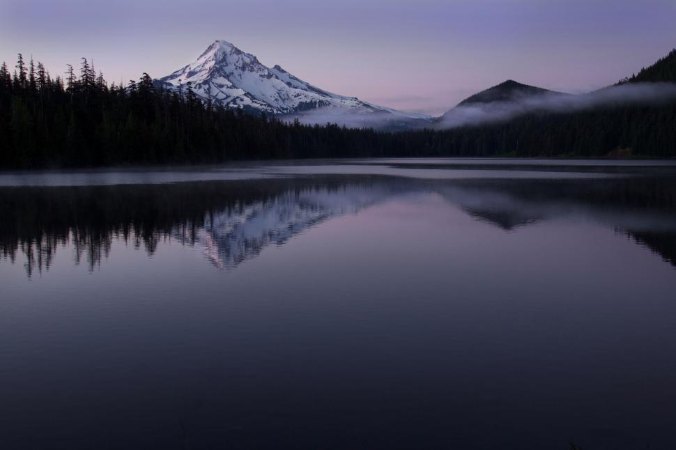 Free Image of Tranquil mountain reflection in a forest lake 