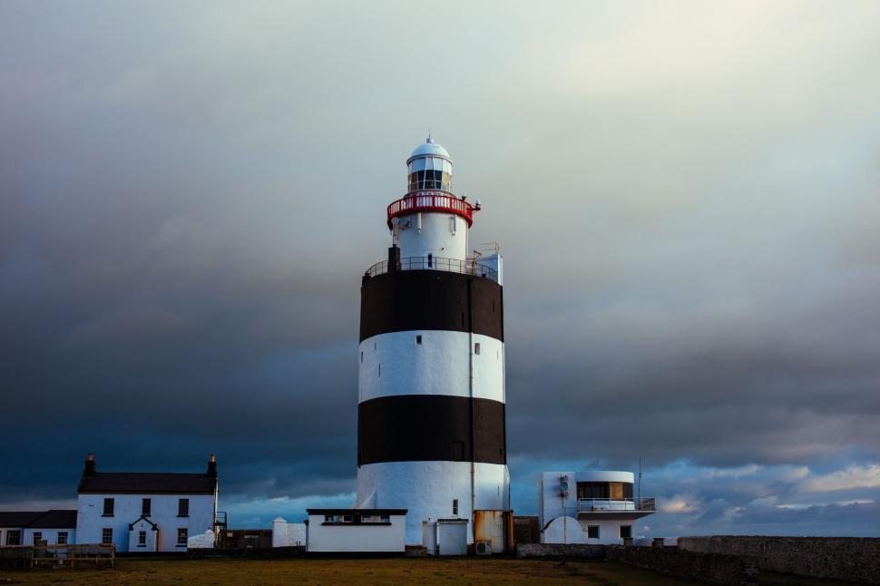 Free Image of Lighthouse against moody sky at dusk 