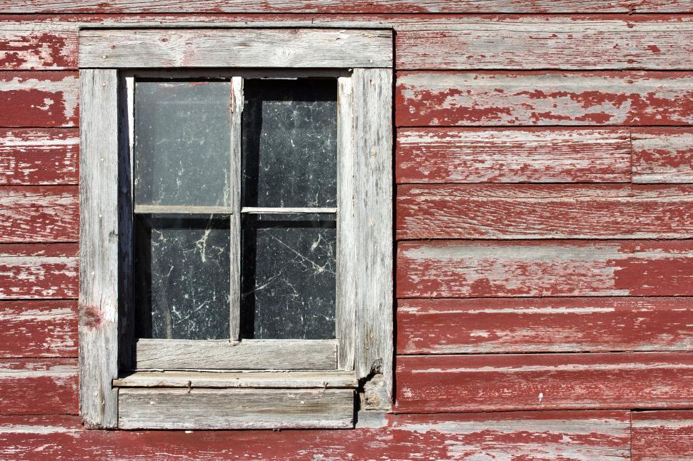 Free Image of Rustic wooden window on a weathered red barn 
