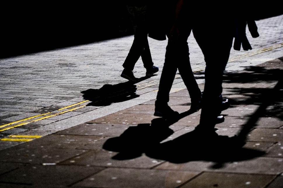 Free Image of Mysterious silhouette of people walking at night 