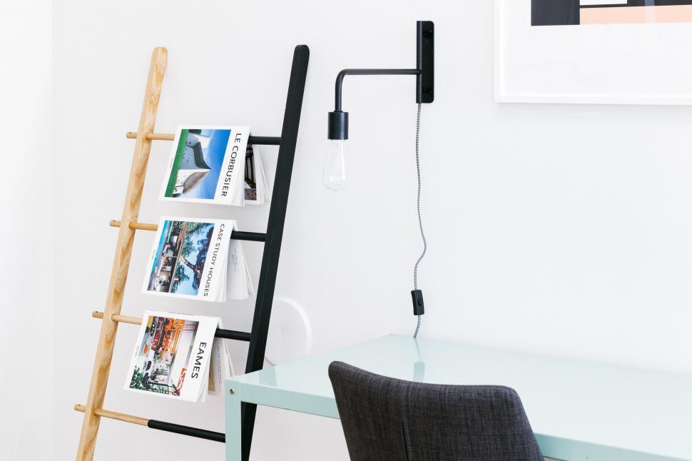 Free Image of Cozy workspace with black leaning ladder shelf 
