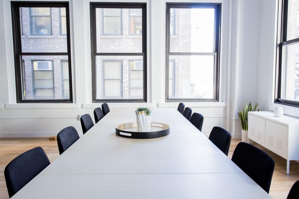 Free Image of Modern office conference room with large windows 
