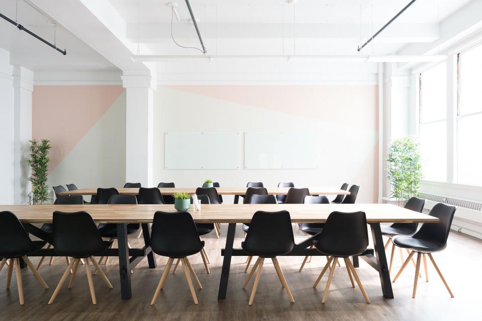 Free Image of Modern conference room with long table and chairs 