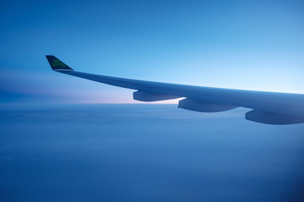 Free Image of Serene airplane wing against twilight sky 