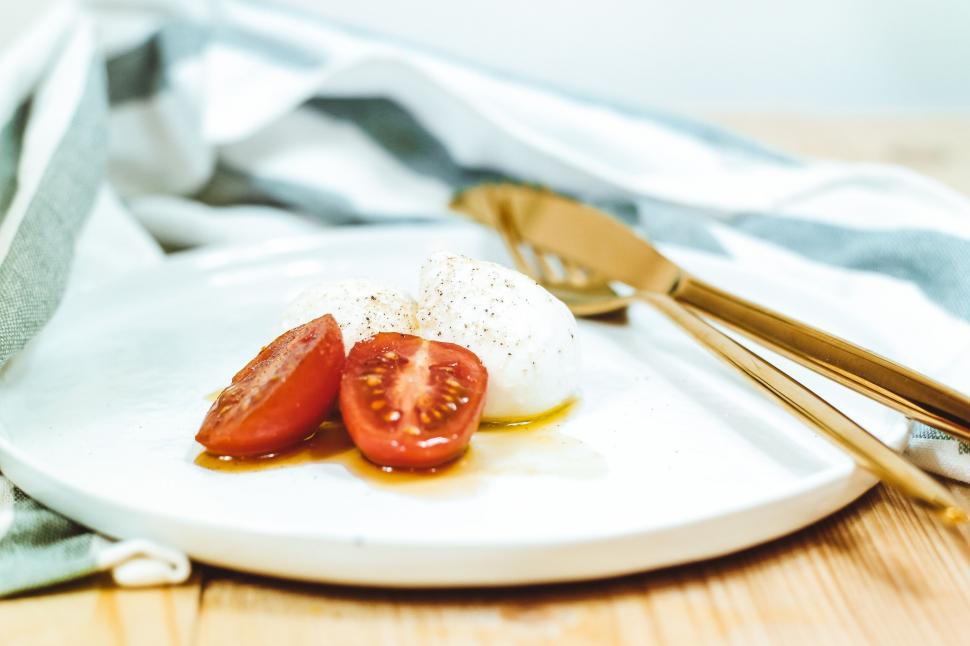 Free Image of Tomato and mozzarella on a white plate 