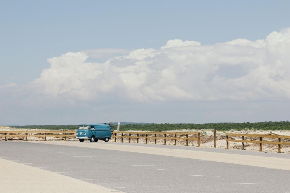 Free Image of Van cruising on a deserted coastal road 