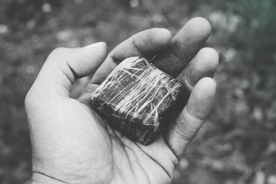 Free Image of Monochrome image of hand holding rock 