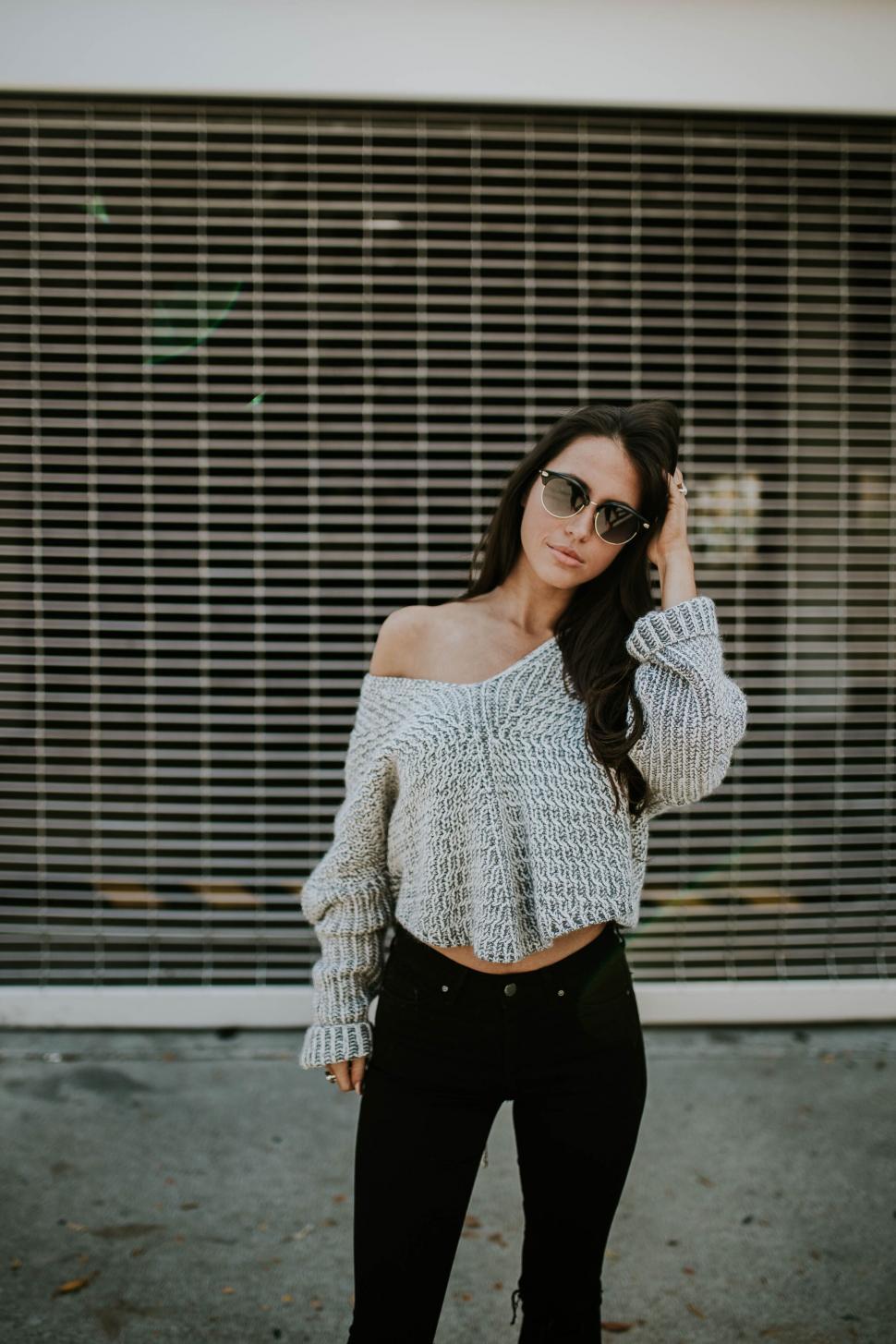 Free Image of Casual woman posing with sunglasses 