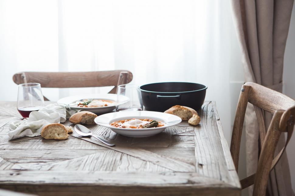 Free Image of Homely meal table setup with pasta and wine 